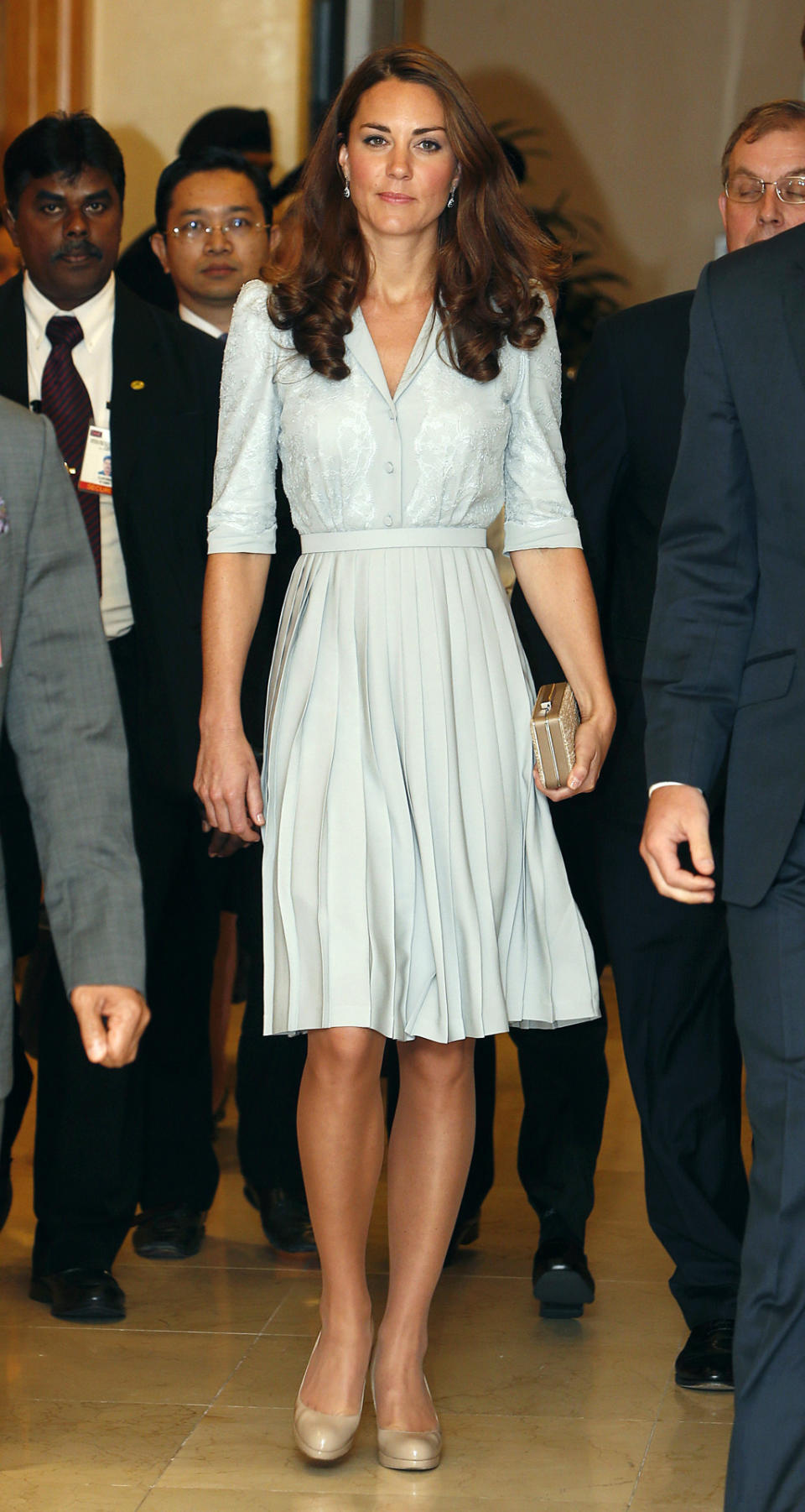 <p>For her arrival in Kuala Lumpur, Kate donned a duck egg blue dress by Jenny Packham along with nude L.K. Bennett pumps.</p><p><i>[Photo: PA]</i></p>