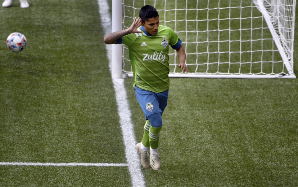 Seattle Sounders forward Raul Ruidiaz celebrates after scoring during second half of an MLS soccer match against the Portland Timbers in Portland, Ore., Sunday, May 9, 2021. (AP Photo/Steve Dykes)