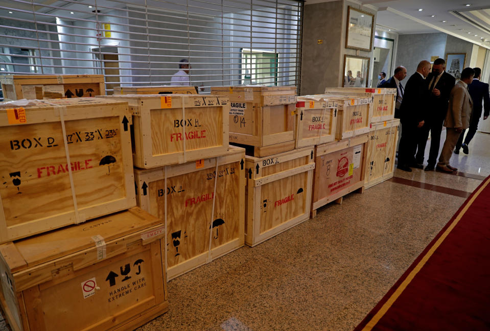 Boxes containing recovered looted artifacts sit temporarily at the foreign ministry before being transferred to the Iraq Museum, in Baghdad, Iraq, Tuesday, Aug. 3, 2021. Over 17,000 looted ancient artefacts recovered from the United States and other countries were handed over to Iraq's Culture Ministry on Tuesday, a restitution described by the government as the largest in the country's history. The majority of the artefacts date back 4,000 years to ancient Mesopotamia and were recovered from the U.S. in a recent trip by Prime Minister Mustafa al-Kadhim. (AP Photo/Khalid Mohammed)