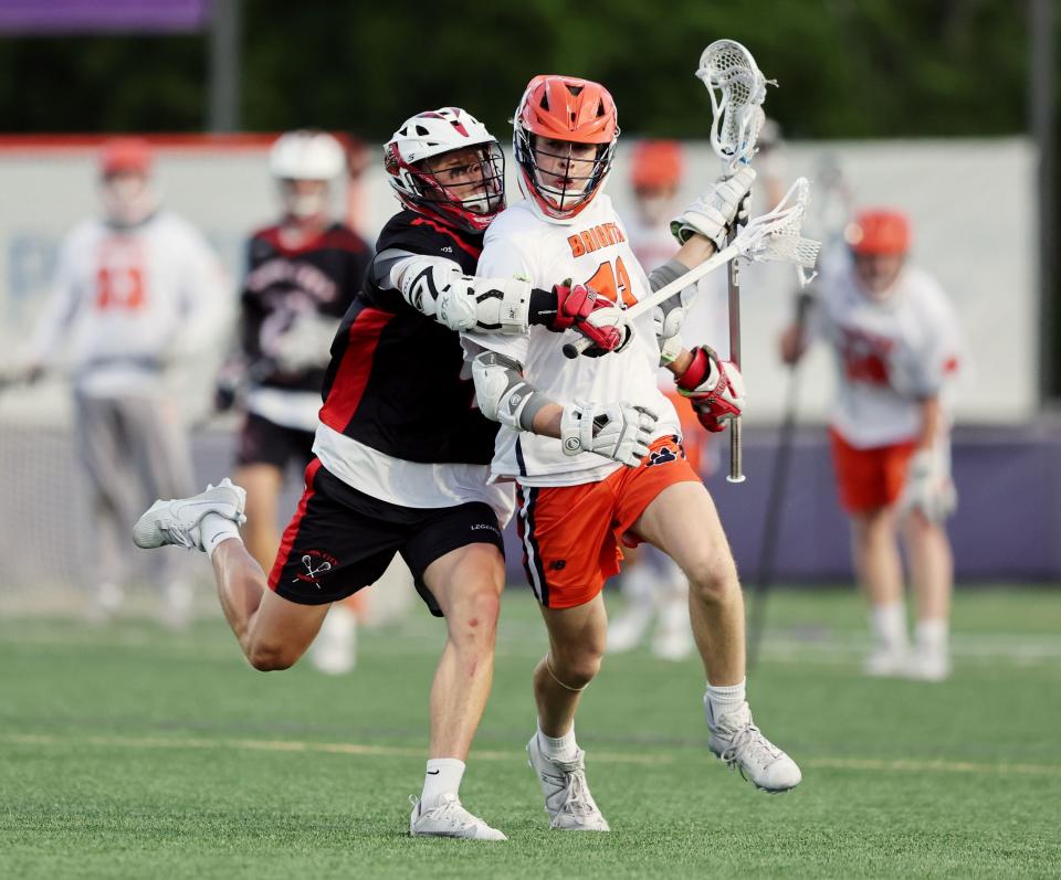 Park City’s Beckett Wolf, works to defend Brighton’s Boston Middaugh as they play in semifinal lacrosse action at Westminster in Salt Lake City on Wednesday, May 24, 2023. | Scott G Winterton, Deseret News