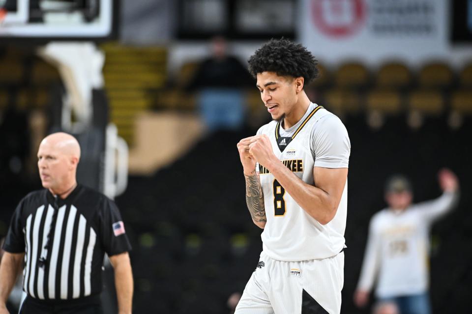 UW-Milwaukee guard Erik Pratt celebrates after scoring against Chattanooga in overtime of their game Friday at the UW-Milwaukee Panther Arena.