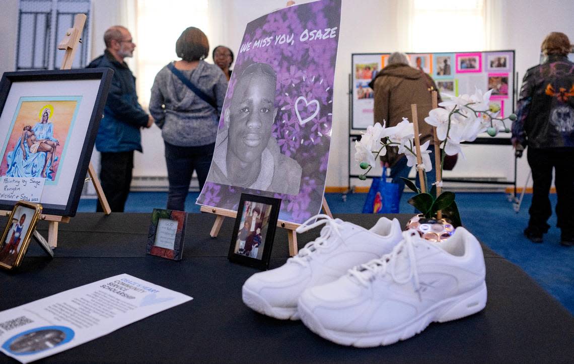 Attendees browse the photos and mementos honoring Osaze Osagie during the Osaze’s Heart Scholarship fundraiser dinner on Tuesday, March 19, 2024 at the State College Access Church.