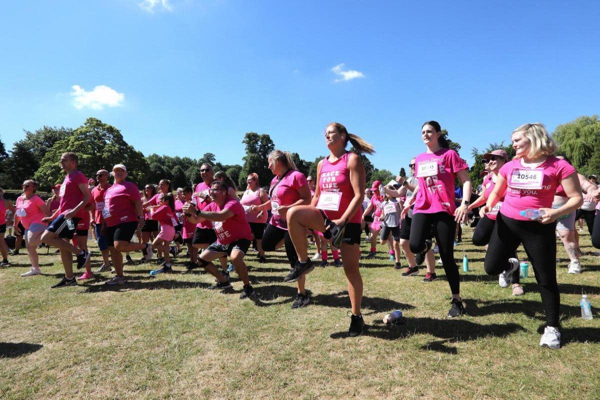 Pink - runners preparing for the Race For Life <i>(Image: Newsquest)</i>