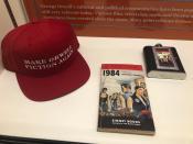In this Oct. 23, 2019, photo, a vintage copy of George Orwell's 1949 novel "1984" next to a hat about Orwell is shown at an exhibit in Albuquerque, N.M. celebrating the author's legacy. The exhibit at the University of New Mexico is tackling the themes of the novelist's work from "1984" to "Animal Farm." "George Orwell: His Enduring Legacy," which runs to April 2020, features posters and material related to work challenging totalitarianism. (AP Photo/ Russell Contreras)