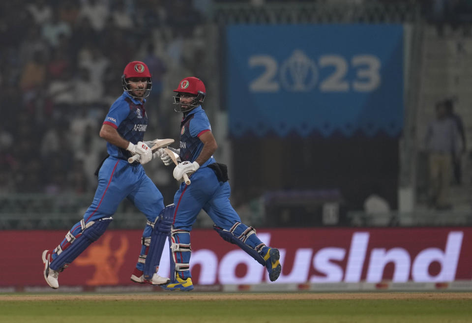 Afghanistan's captain Hashimatullah Shahidi and Rahmat Shah run between the wickets during the ICC Men's Cricket World Cup match between Afghanistan and Netherlands in Lucknow, India, Friday, Nov. 3, 2023. (AP Photo/Altaf Qadri)