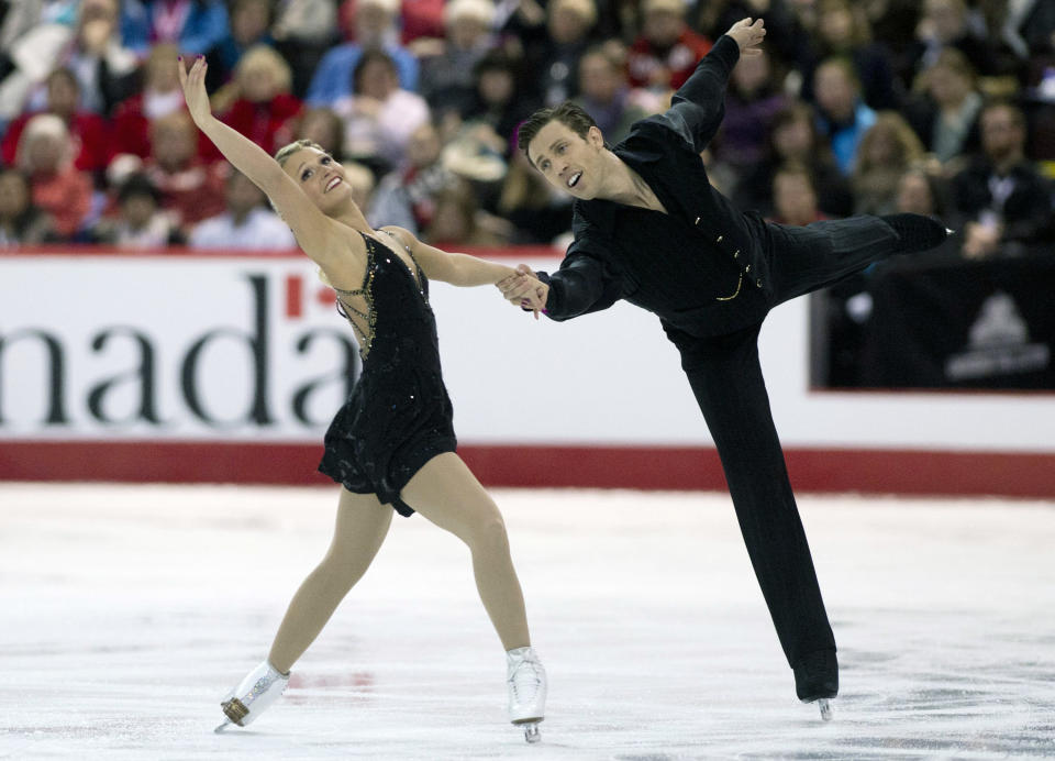 Kirsten Moore-Towers and Dylan Moscovitch perform their free program in pairs competition at the Canadian Skating Championships Saturday Jan. 11, 2014 in Ottawa, Ontario. (AP Photo/The Canadian Press, Adrian Wyld)