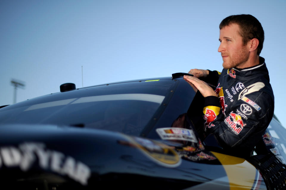 HOMESTEAD, FL - NOVEMBER 19: Kasey Kahne, driver of the #4 Red Bull Toyota, climbs out of his car after qualifying for the NASCAR Sprint Cup Series Ford 400 at Homestead-Miami Speedway on November 19, 2011 in Homestead, Florida. (Photo by Jared C. Tilton/Getty Images)