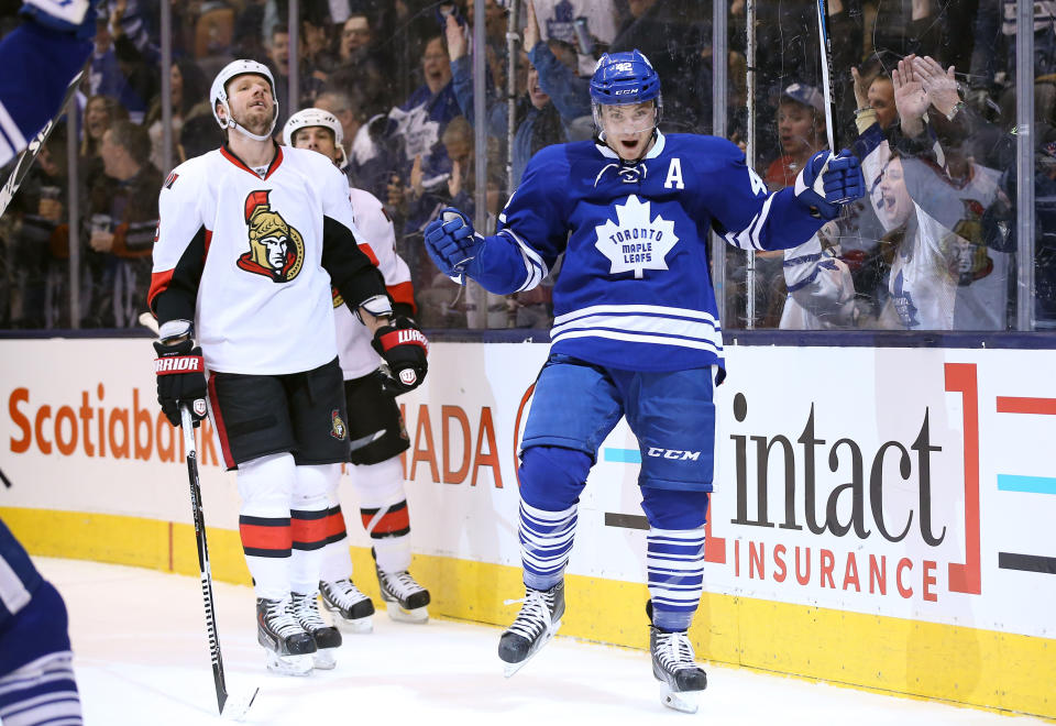 Mar 28, 2015; Toronto, Ontario, CAN; Toronto Maple Leafs center Tyler Bozak (42) celebrates his tying goal in the third period against the Ottawa Senators at Air Canada Centre. The Maple Leafs beat the Senators 4-3 in overtime. (Tom Szczerbowski-USA TODAY Sports)