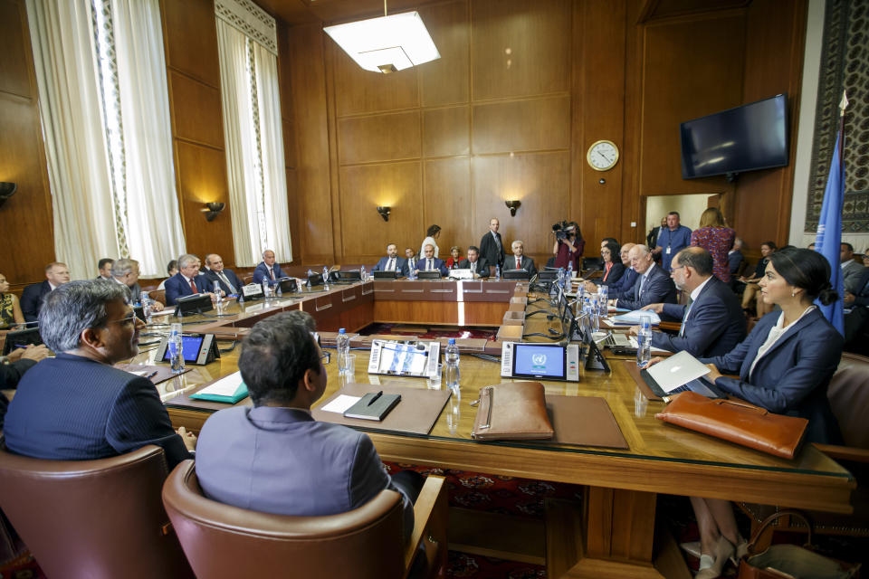 Iran's Deputy Foreign Minister Hossein Jaber Ansari, Russia's special envoy on Syria Alexander Lavrentiev, Turkish Foreign Ministry Deputy Sedat Onal, and UN Special Envoy of the Secretary-General for Syria Staffan de Mistura attend a meeting during the consultations on Syria, at the European headquarters of the United Nations in Geneva, Switzerland, Tuesday, Sept. 11, 2018. Representatives of Russia, Turkey and Iran, meet with the UN Special Envoy of the Secretary-General for Syria to discuss the situation in Syria. (Salvatore Di Nolfi/Keystone via AP, Pool)