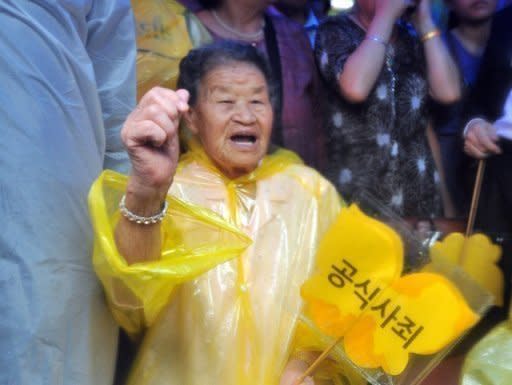 A former South Korean "comfort woman" -- who was forced to serve as a sex slave for Japanese troops during World War II -- demonstrates outside the Japanese embassy in Seoul. China and South Korea have pressed Japan to face up to its wartime past, as festering territorial disputes flared and Asia marked the anniversary of Tokyo's World War II surrender