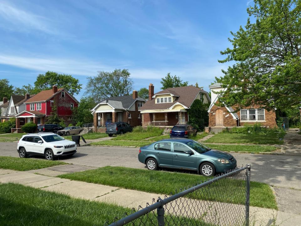 a street in detroit with abanonded houses