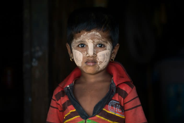 A minority Muslim Rohingya child wearing traditional facial paste is seen in a shelter at the Thet Kal Pyin displacement camp in Sittwe on September 7, 2016