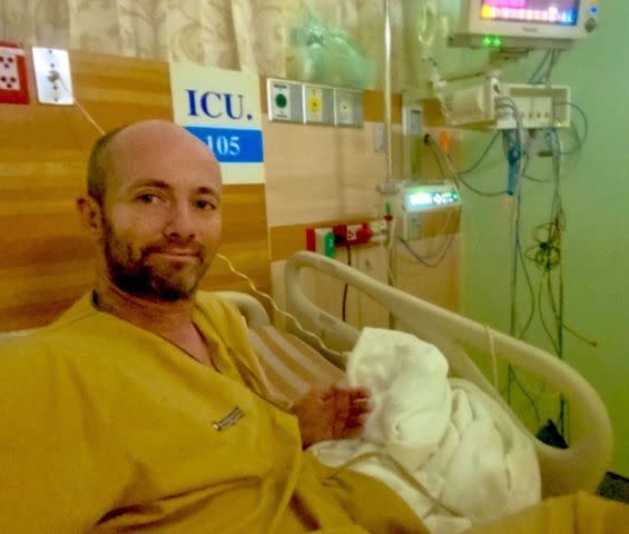 <p>Niall Harbison/X</p> Niall Harbison in his bed during his December 2020/January 2021 hospital stay in Thailand