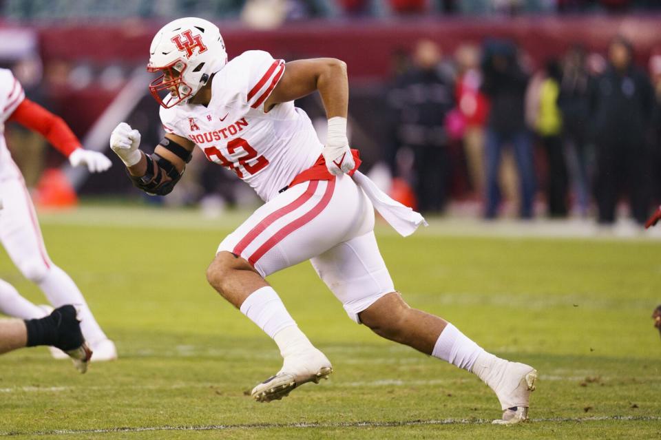 Houston defensive lineman Logan Hall rushes the passer against Temple in November.