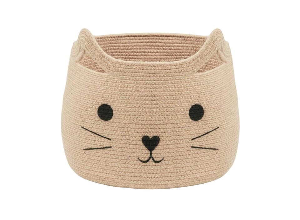 What better way to make your home both stylish and cat friendly than with a basket with an adorable kitty face on it? (Source: Amazon)