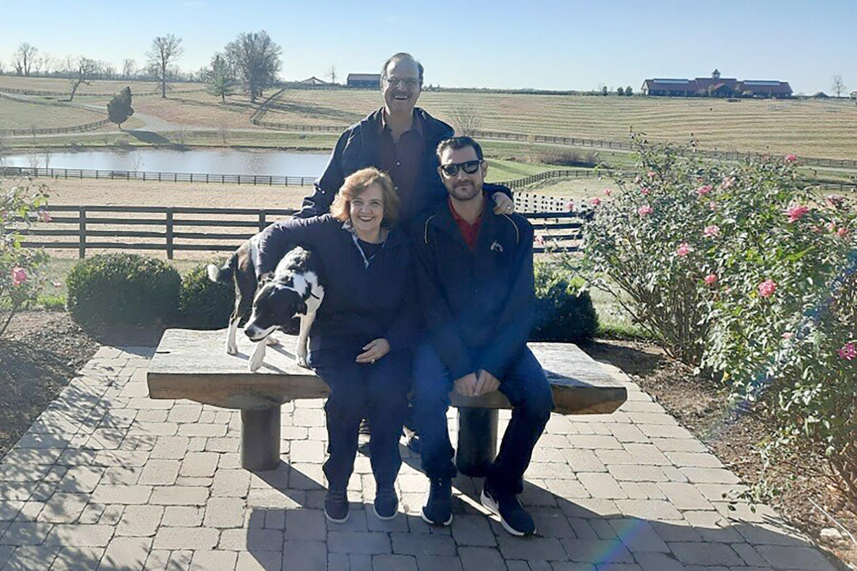 Austin Johnson with his parents, Philip and Kathy Johnson, in November after his treatment at the University of Michigan. (Courtesy Austin Johnson)