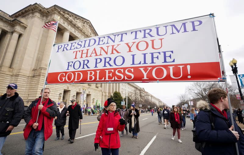 FILE PHOTO: Anti-abortion activists march with banner thanking President Trump during the 47th annual March for Life in Washington