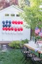 <p>Enlist your family to help you blow up these balloons, then use tape to stick them in place.</p><p><em><strong>Get the tutorial from <a href="https://www.ellaclaireinspired.com/patriotic-balloon-flag/" rel="nofollow noopener" target="_blank" data-ylk="slk:Ella Claire Inspired;elm:context_link;itc:0;sec:content-canvas" class="link ">Ella Claire Inspired</a>.</strong></em><br></p>