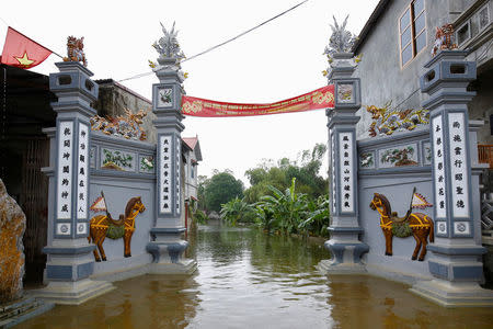 A flooded communal house is seen after a heavy rain caused by a tropical depression in Hanoi, Vietnam October 16, 2017. REUTERS/Kham