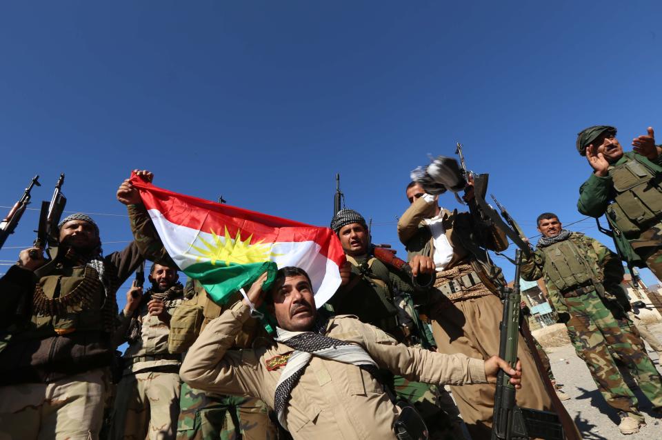 Iraqi autonomous Kurdish region's peshmerga forces and fighters from the Yazidi minority