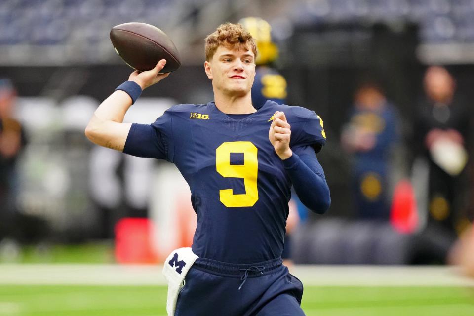 Michigan quarterback J.J. McCarthy (9) passes the ball during a practice session before the College Football Playoff national championship game against Washington at NRG Stadium in Houston on Jan. 6. 2024.