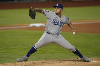 Los Angeles Dodgers starting pitcher Julio Urias throws against the Tampa Bay Rays during the first inning in Game 4 of the baseball World Series Saturday, Oct. 24, 2020, in Arlington, Texas. (AP Photo/Eric Gay)