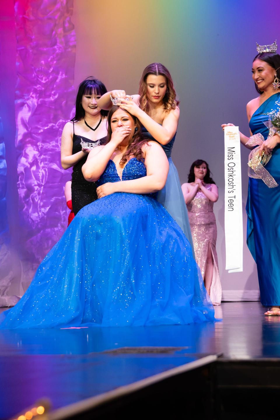 Jayden Dalton is crowned Miss Oshkosh's Teen 2024 by outgoing Miss Oshkosh's Teen 2023 Madelyn Rutkowski.