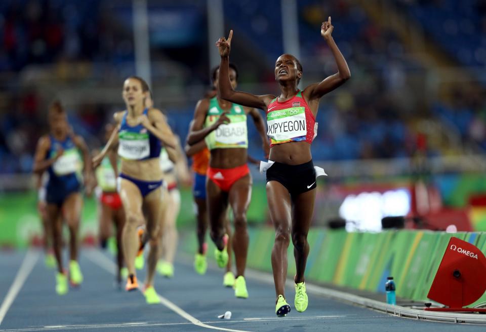 <p>Faith Chepngetich Kipyegon of Kenya celebrates winning the gold medal in the Women’s 1500m Final on Day 11 of the Rio 2016 Olympic Games at the Olympic Stadium on August 16, 2016 in Rio de Janeiro, Brazil. (Photo by Patrick Smith/Getty Images) </p>