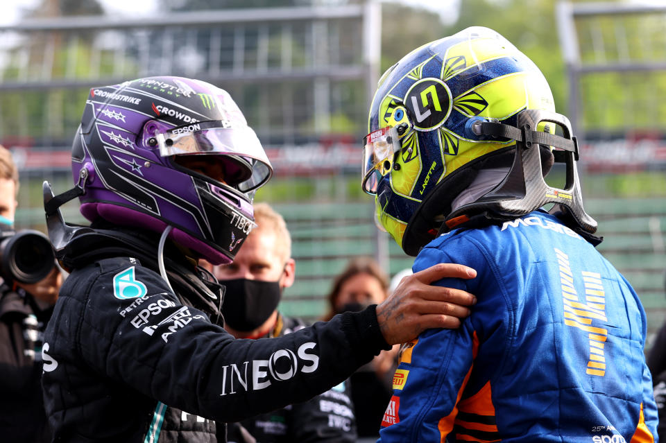IMOLA, ITALY - APRIL 18: Second placed Lewis Hamilton of Great Britain and Mercedes GP and third placed Lando Norris of Great Britain and McLaren F1 hug in parc ferme during the F1 Grand Prix of Emilia Romagna at Autodromo Enzo e Dino Ferrari on April 18, 2021 in Imola, Italy. (Photo by Bryn Lennon/Getty Images)