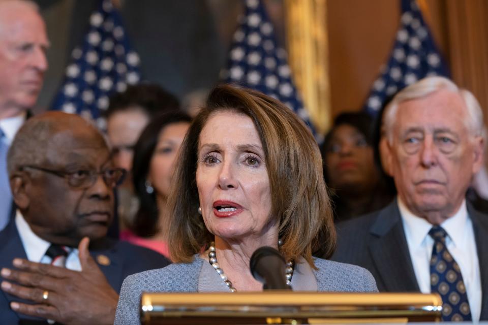 Speaker of the House Nancy Pelosi, D-Calif., flanked by Majority Whip James E. Clyburn, D-S.C., left, and House Majority Leader Steny Hoyer, D-Md.speak at the Capitol March 26, 2019.