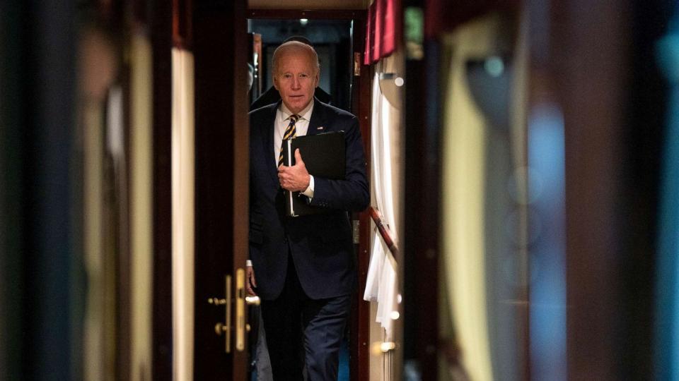 PHOTO: In this Feb. 20, 2023, file photo, President Joe Biden walks down a corridor to his cabin on a train after a surprise visit with Ukrainian President Volodymyr Zelenskyy in Kyiv. Biden took a nearly 10-hour train ride from Poland into Kyiv. (Evan Vucci/AP, FILE)