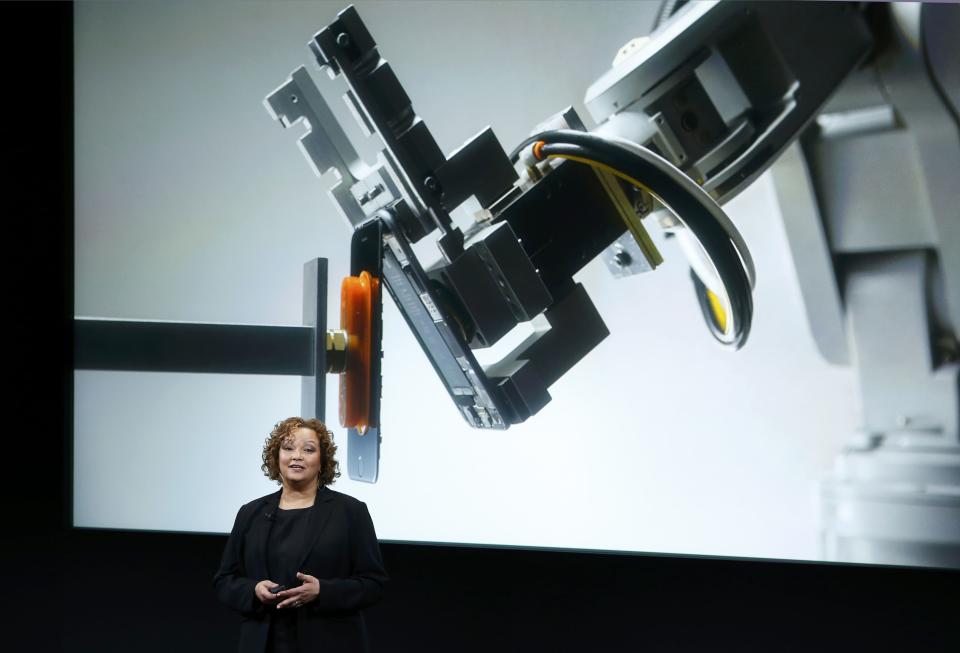 Lisa Jackson, Apple vice president for Environment, Policy and Social Initiatives, introduces a robot named Liam that deconstructs iPhones during an event at Apple headquarters in Cupertino, California March 21, 2016. REUTERS/Stephan Lam