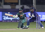 Pakistan's Mohammad Rizwan bats during the Cricket Twenty20 World Cup match between India and Pakistan in Dubai, UAE, Sunday, Oct. 24, 2021. (AP Photo/Aijaz Rahi)