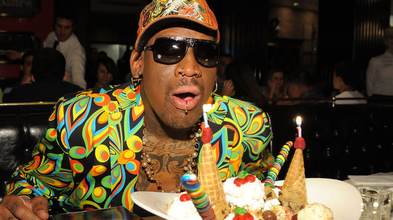 Dennis Rodman blowing out birthday candles