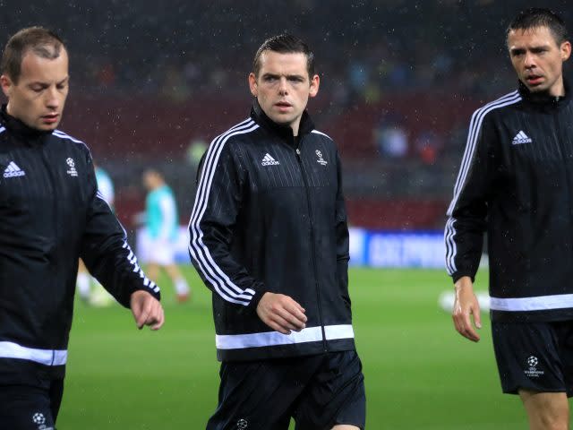 Douglas Ross (centre) warming up for the game in Barcelona (John Walton/Empics/PA)