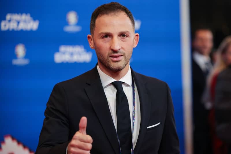 Domenico Tedesco, coach of Belgium, arrives at the UEFA Euro 2024 Championship draw in Hamburg. Tedesco said he's not considering a premature departure amid rumours that AC Milan would be interested in signing him. Christian Charisius/dpa