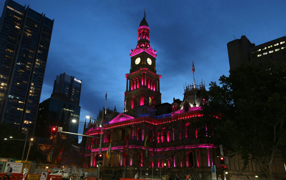 <p>Town Hall is lit up with pink lights as the gay community and their supporters celebrate the result of a postal survey calling for gay marriage right in Sydney, Australia, Wednesday, Nov. 15, 2017. (Photo: Rick Rycroft/AP) </p>