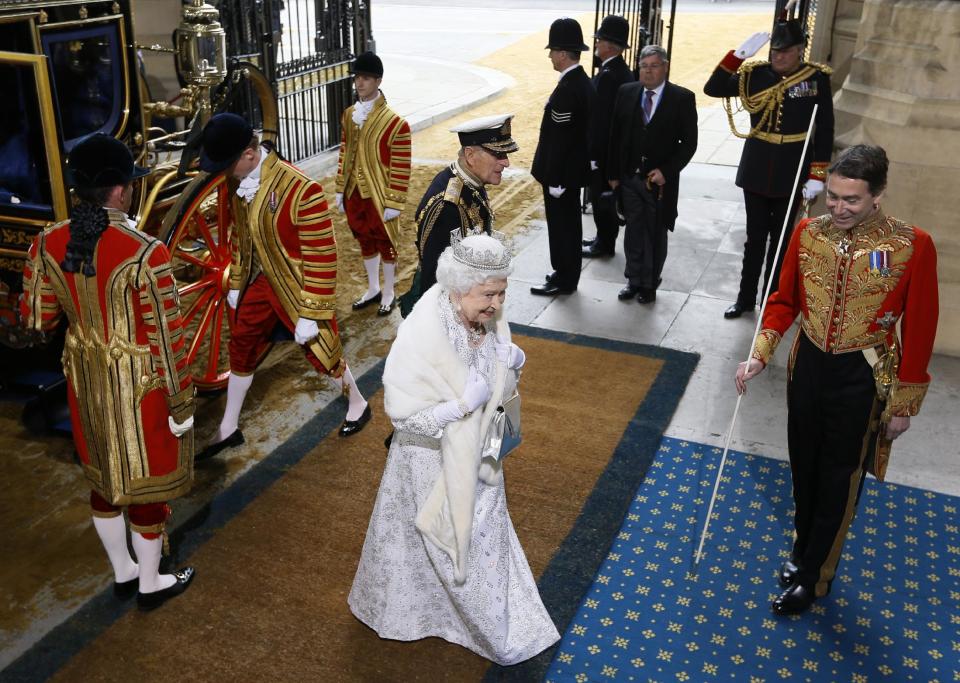 Britain's Queen Elizabeth II and The Duke of Edinburgh arrive for the State Opening of Parliament, at the Houses of Parliament in London, Wednesday, May 8, 2013. The State Opening of Parliament marks the formal start of the parliamentary year, the Queen will deliver a speech which will set out the government's agenda for the coming year. (AP Photo/Kirsty Wigglesworth, Pool)