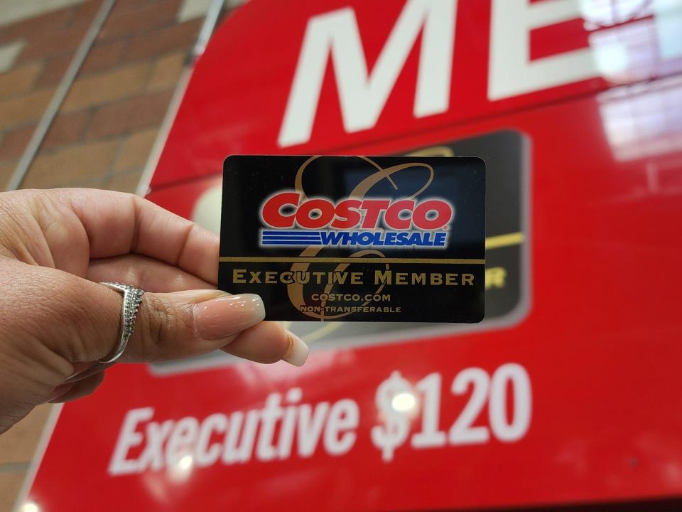 The writer holds a Costco executive-membership card.