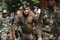 <p>Thai soldiers march from the Tham Luang Nang Non Cave in Chiang Rai Province, northern Thailand, June 29, 2018. Thailand’s prime minister visited the flooded cave complex and urged relatives of the soccer players and their coach to not give up hope. (Photo: Sakchai Lalit/AP) </p>