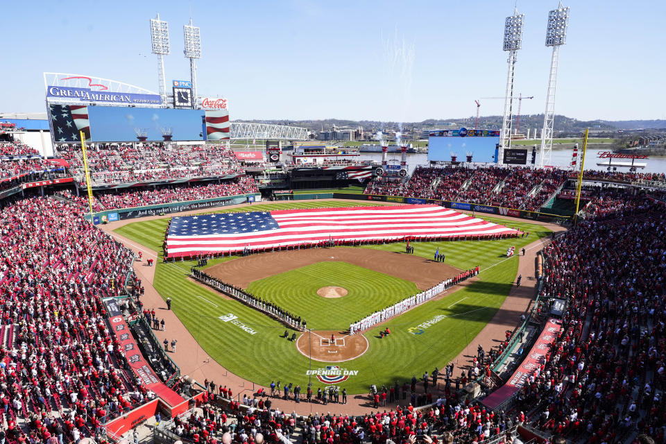 Fans attend an opening day baseball game in Cincinnati between the Pittsburgh Pirates and the Cincinnati Reds, Thursday, March 30, 2023. (AP Photo/Jeff Dean)