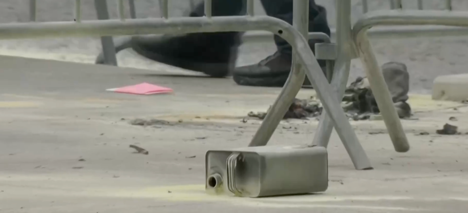 An open container pictured on its side at the scene of a self-immolation near the Manhattan Criminal Court. One witness told The Independent he watched the man pull a can out of his bag and pour it over himself (Reuters)