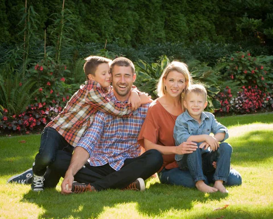 Former Lions quarterback Joey Harrington and his wife, Emily, with their children, Jack, left, and Emmet.