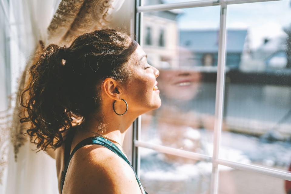 woman enjoying the sunshine during the break between exercises