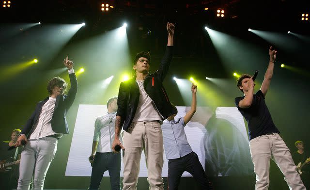 <p>Jo Hale/Redferns via Getty</p> Zayn Malik performing with One Direction in 2012