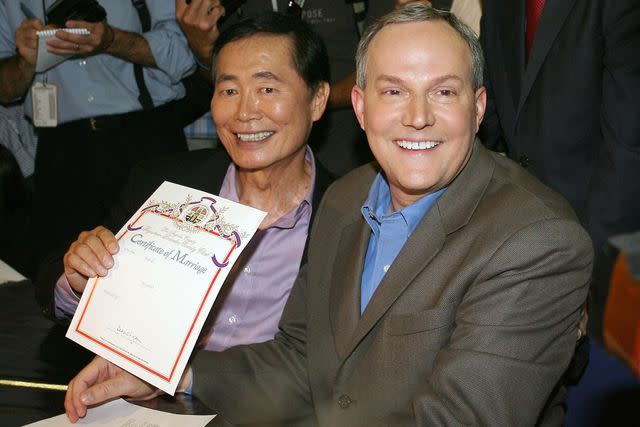 <p>VALERIE MACON/AFP via Getty </p> Brad and George Takei in 2008