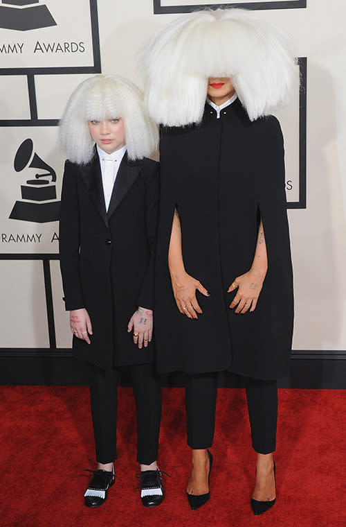 The notoriously shy "Chandelier" singer and her mini-me Maddie Ziegler attended the Grammys together dressed in matching Armani looks. Each stood out from the other in little ways, with Sia in a custom cape, and Maddie wearing black and white brogues, but the overwhelming wigs connected them.