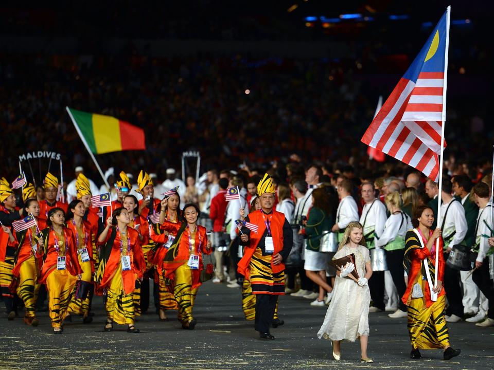 Malaysia olympic team in 2012 wearing striped outfits.