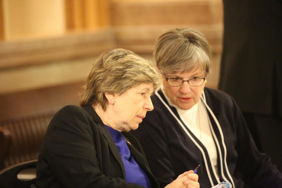 Kansas Gov. Laura Kelly, right, and American Federation of Teachers president Randi Weingarten talk at a labor union rally at the Kansas Statehouse on Wednesday.
