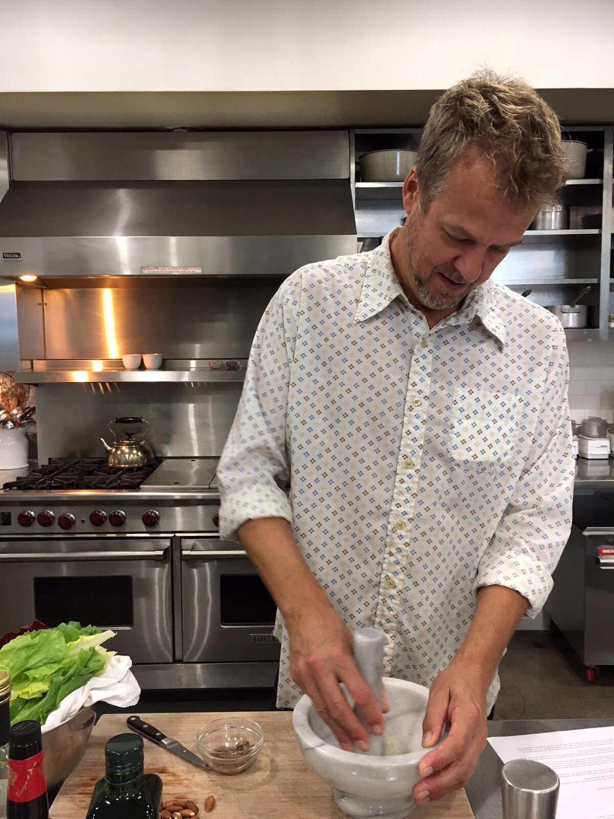 cal peternell using white marble mortar and pestle